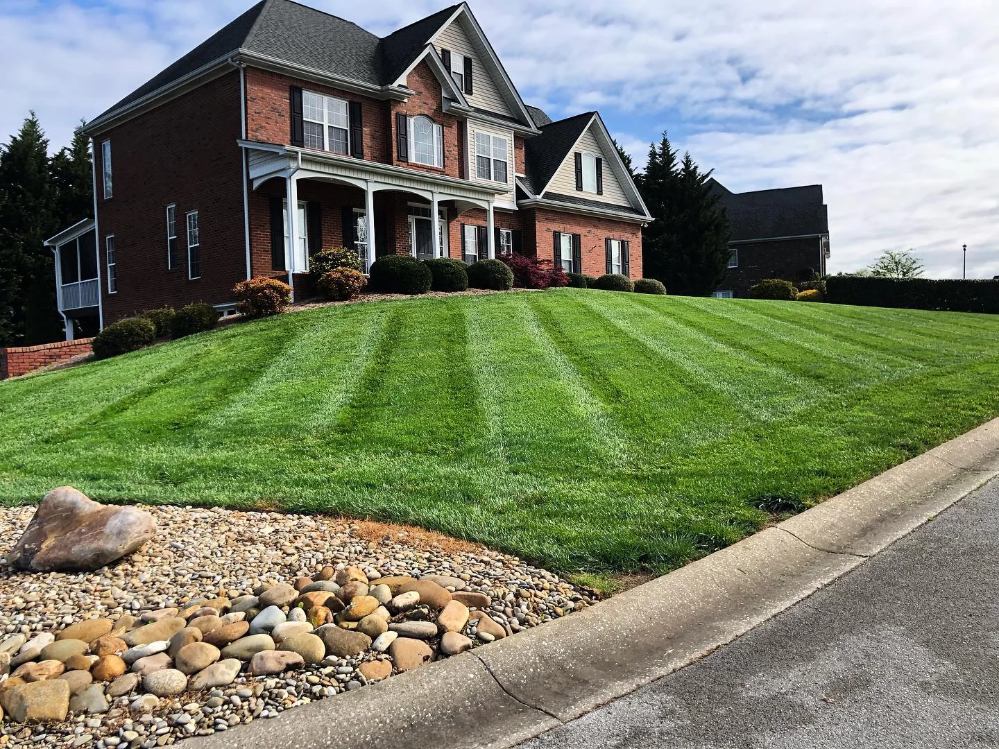 Freshly striped lawn care and landscaping at a Morristown TN home by 3R Outdoor